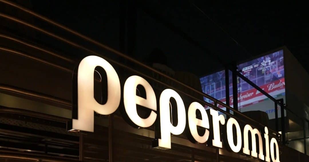 Close-up of the illuminated Peperomia lettering at night